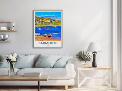 Living room with coastal Barmouth poster on wall.