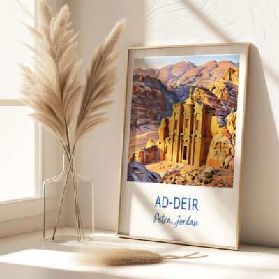 Framed Ad-Deir Petra Jordan art on sunny shelf.