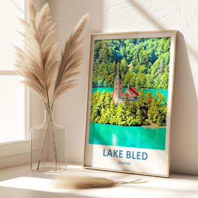 Lake Bled poster beside pampas grass in vase.