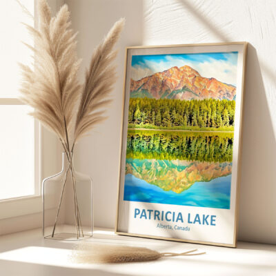 Framed Patricia Lake art beside pampas grass vase.