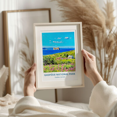Person holding Gaspésie National Park framed poster.