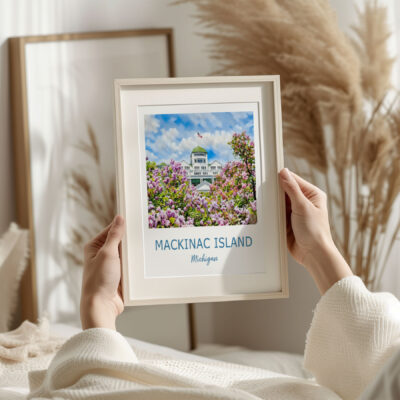 Framed Mackinac Island picture with flowers.
