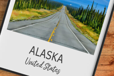 Scenic highway through forest in Alaska, USA.