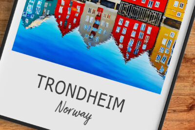 Colorful Trondheim buildings reflected in water, Norway.