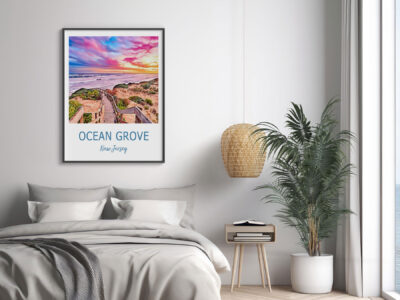 Ocean Grove poster above modern bedroom decor.