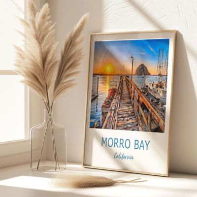 Framed Morro Bay sunset photo on sunny windowsill.