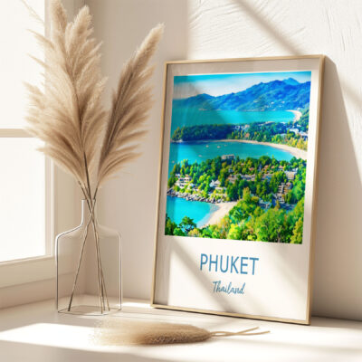 Framed Phuket photo by window with decorative vase.