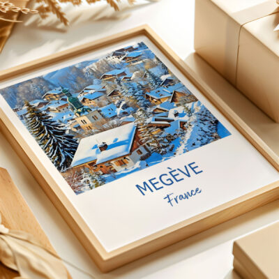 Framed artwork of snowy Megève village in France.