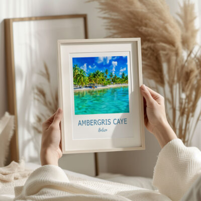 Person holding Ambergris Caye tourism photo.