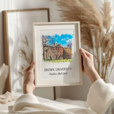 Framed Brown University artwork in cozy room.
