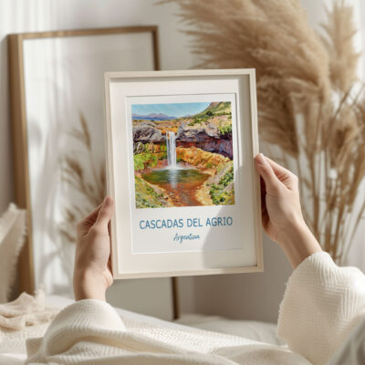 Holding framed Cascadas del Agrio artwork, Argentina.