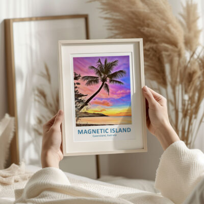 Framed Magnetic Island sunset photo in cozy room.