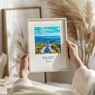 Framed Phuket photo in cozy room setting.