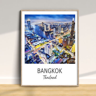 Framed Bangkok cityscape poster on wall.