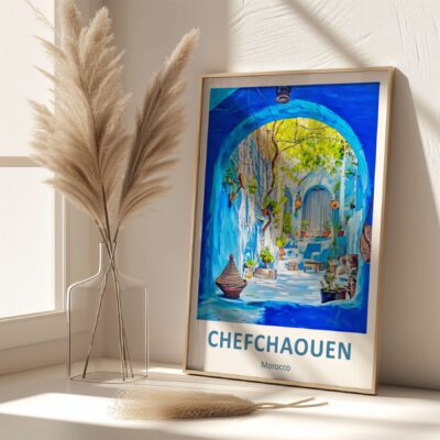 Framed Chefchaouen poster next to decorative vase.