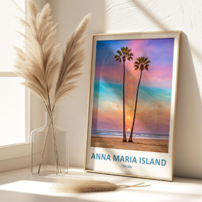 Framed beach sunset artwork on display table.