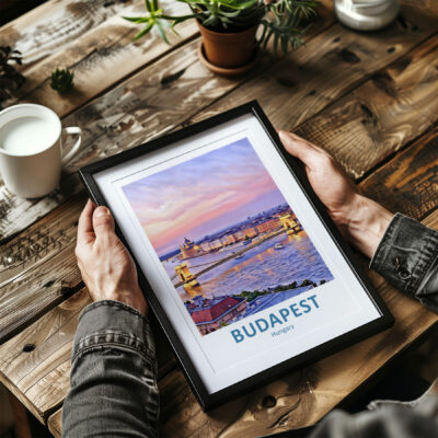 Framed Budapest photo on wooden table.