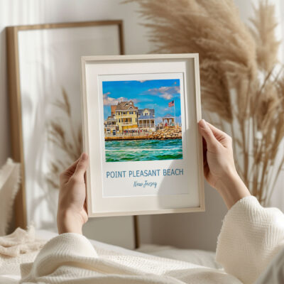 Framed Point Pleasant Beach artwork in cozy setting.