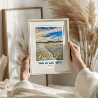 Framed Santa Monica beach print in cozy room.