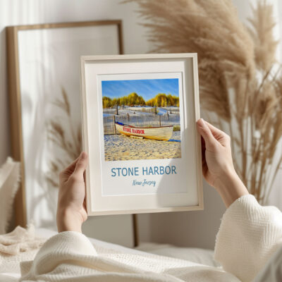 Framed Stone Harbor beach print in cozy setting.