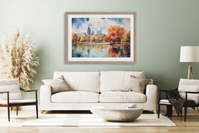Cozy living room with framed watercolor cityscape.