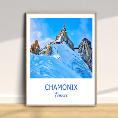 Framed Chamonix mountain artwork on wooden floor.