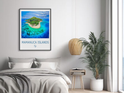 Bedroom with Mamanuca Islands Fiji poster on wall.