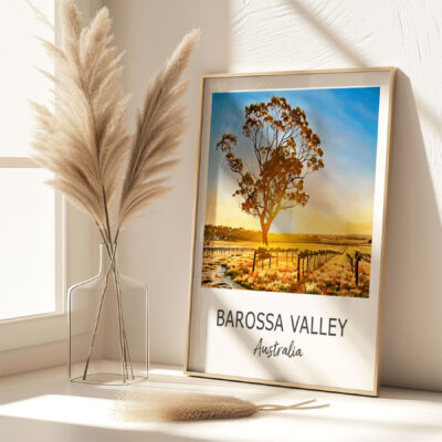 Framed Barossa Valley Australia landscape art on table.