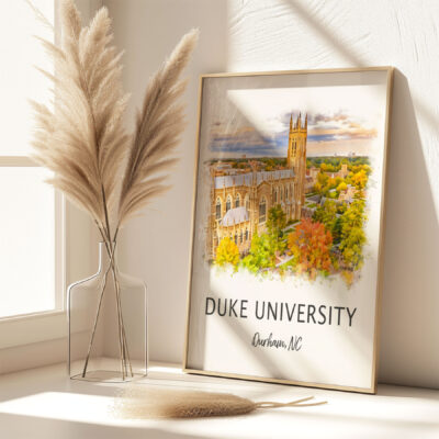 Framed Duke University artwork on sunny windowsill.