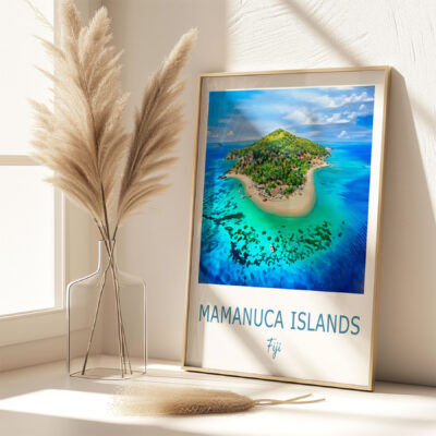 Framed photo of Mamanuca Islands, Fiji, beside vase.