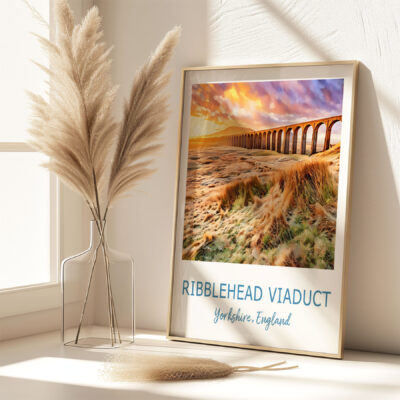 Framed Ribblehead Viaduct photo beside pampas grass vase.