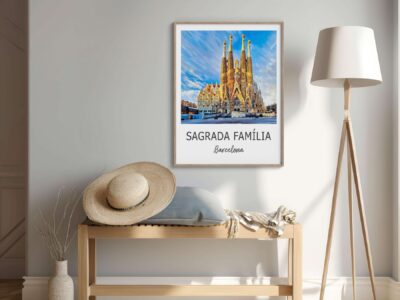 Room with Sagrada Família poster on wall.