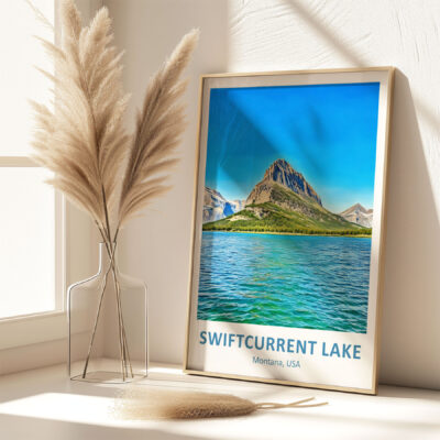 Framed Swiftcurrent Lake poster with decorative vase.