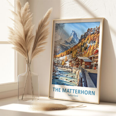 Framed Matterhorn poster with pampas grass in vase.