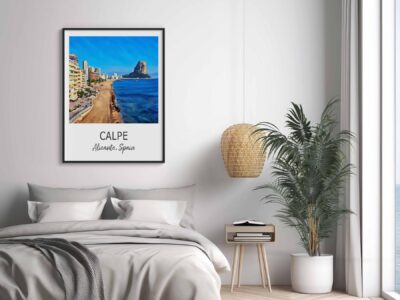 Bedroom with beach city wall art and plants.