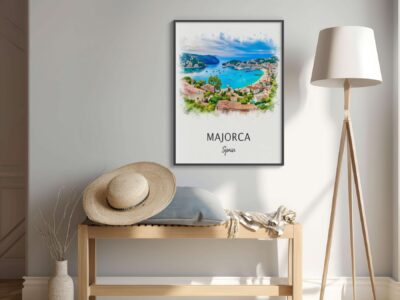 Framed Majorca poster above bench and lamp.
