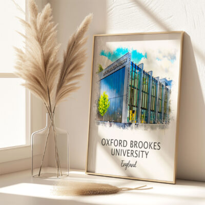 Framed Oxford Brookes University England artwork beside vase.