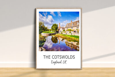 Cotswolds landscape with houses and river reflection.