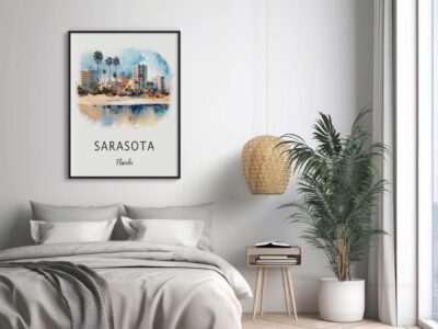 Bedroom with Sarasota cityscape art on wall.