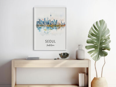 Framed Seoul skyline art above wooden console.