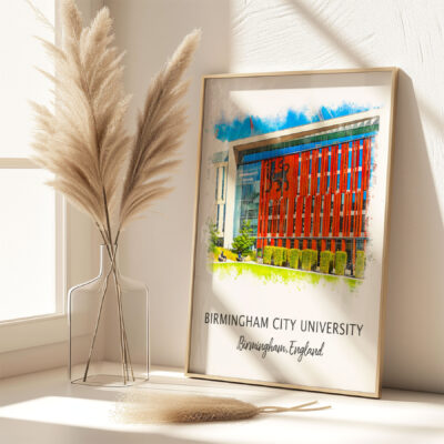 Framed Birmingham City University building artwork on shelf.
