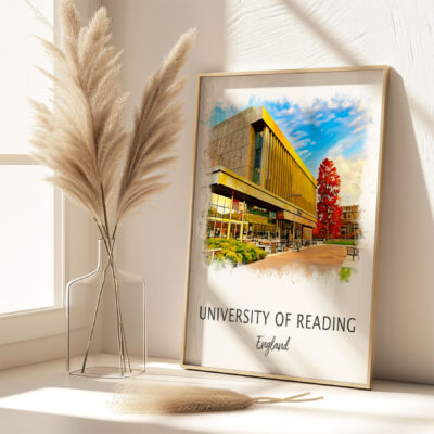 Framed University of Reading artwork on sunny desk.