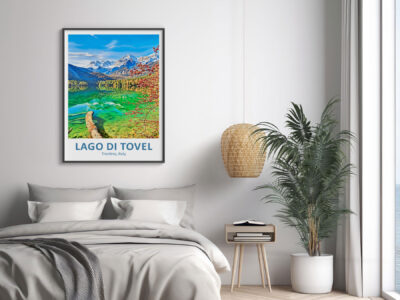Bedroom with Lago di Tovel poster and plant.
