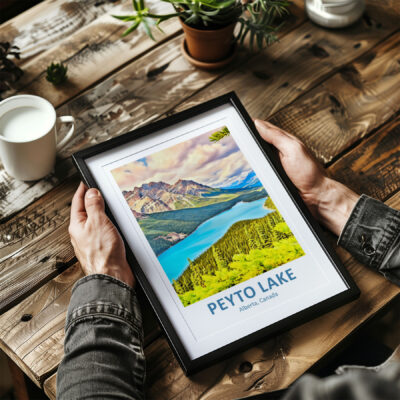 Framed Peyto Lake photo held by person at table.