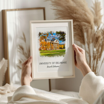 Hands holding framed University of Delaware print.